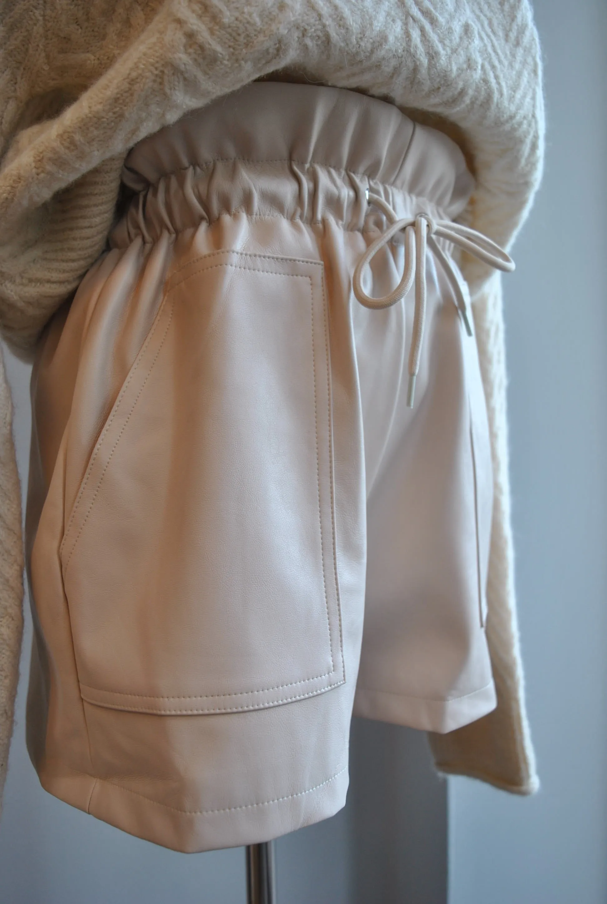 CLEARANCE - SAND COLOR FAUX LEATHER SHORTS WITH ELASTIC WAIST AND SIDE POCKETS